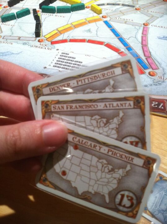 Ticket to Ride - 3 different routes.  The cards are in mini sleeves. - Credit: vacekrae