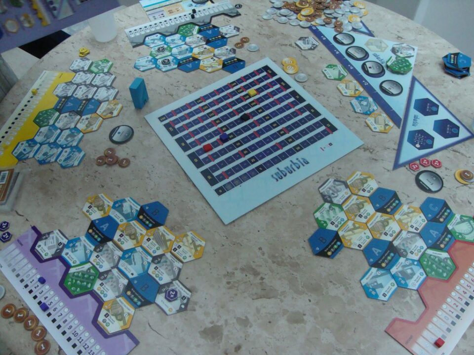 Suburbia - Suburbia is a tile-laying game in which each player tries to build up an economic engine and infrastructure that will be initially self-sufficient, and eventually become both profitable and encourage population growth. #2 - Credit: Boeschenstein