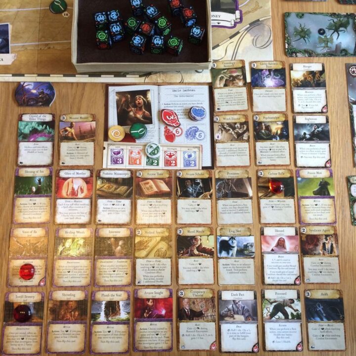 Eldritch Horror - Marie Lambeau and the incredible selection of cards she ended the game with. - Credit: Interociter