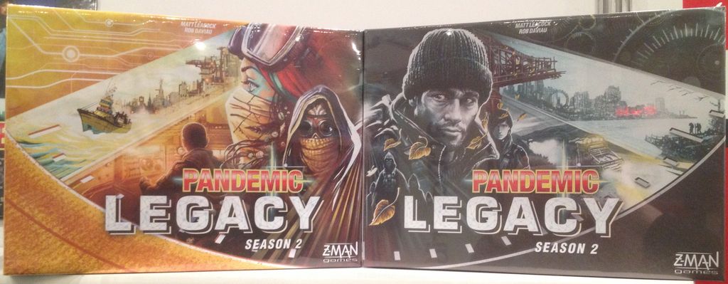 Pandemic Legacy: Season 2 - Pandemic Legacy: Season 2, Z-Man Games, 2017 — both front covers, shot at NY Toy Fair 2017 - Credit: W Eric Martin