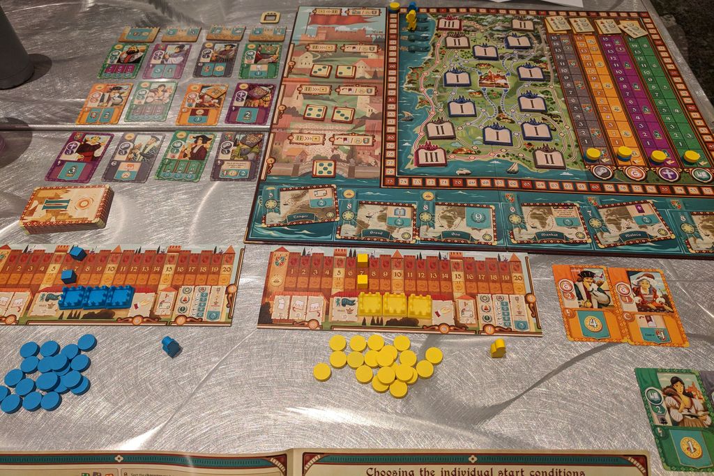 Coimbra - Setting up a game while reading the rules. (Yes the monastery tiles should be filled over eh heh) - Credit: SerAmanda
