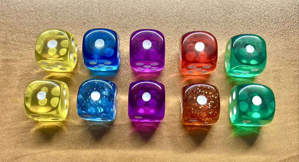 Sagrada - Colour blind option for dice. Speckled red transparent dice added to distinguish green and red. Speckled blue transparent dice added to distinguish purple and blue. - Credit: sikmag