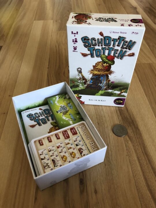 Schotten Totten - Game box, packed up (with a quarter for scale). There's more air in the box than there needs to be. Perhaps it's crying out to house Battle Line as well, or some rethemes? - Credit: c_mcc