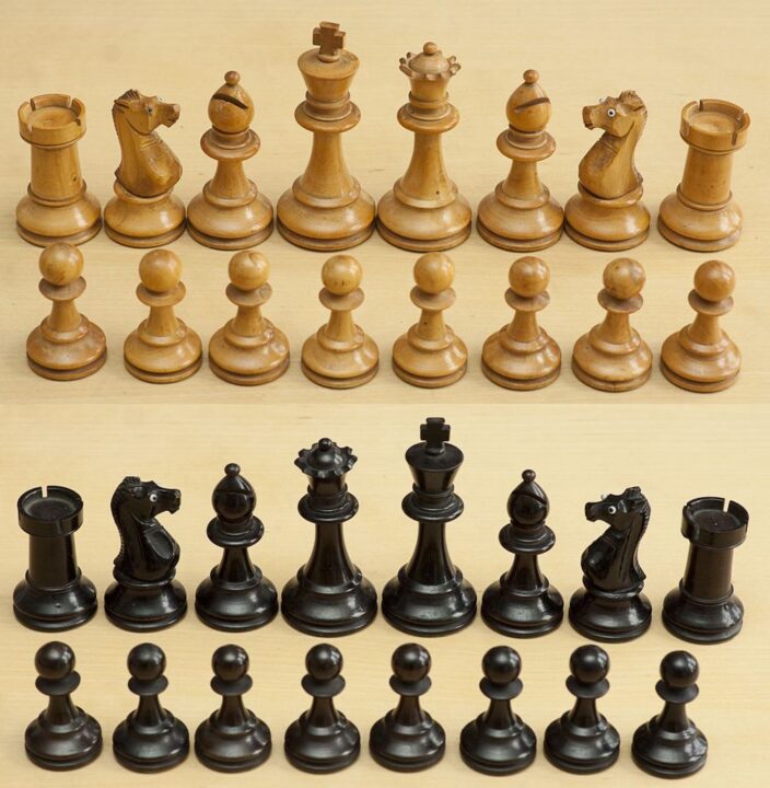 Chess - Ebony and boxwood chessmen. The knights have inset glass eyes. - Credit: photocurio