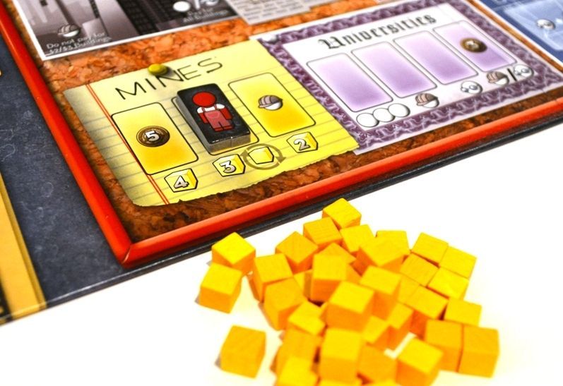 The Manhattan Project - The "Mine" spaces on the central board along with a pile of Yellow Cake - Credit: kilroy_locke