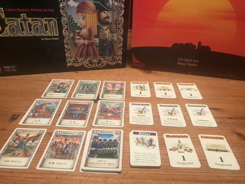 CATAN - Development Cards: Japanese (left) & 1st German edition (right) - Credit: Reinhard Sabel