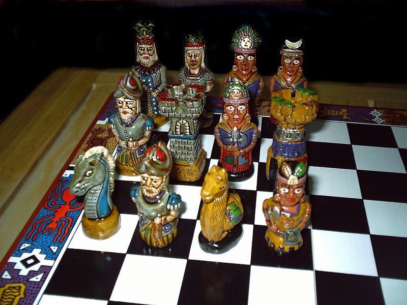 Chess - Detail of pieces from a peruvian chess set, with an Incan theme. Note the Nazca designs of the board. - Credit: falcala