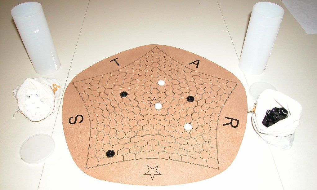 *Star - The beginning of a game of *Star Y, another game which can be played on a *Star board. Kadon vinyl board & stones. - Credit: twixter