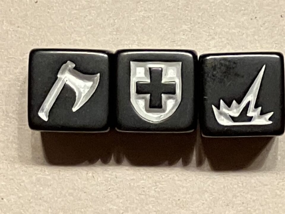 Dragon Slayer - The three Dragon Slayer dice: Each die showing 3x AXE, 2x SHIELD, 1x DRAGON FIRE - Credit: Reinhard Sabel