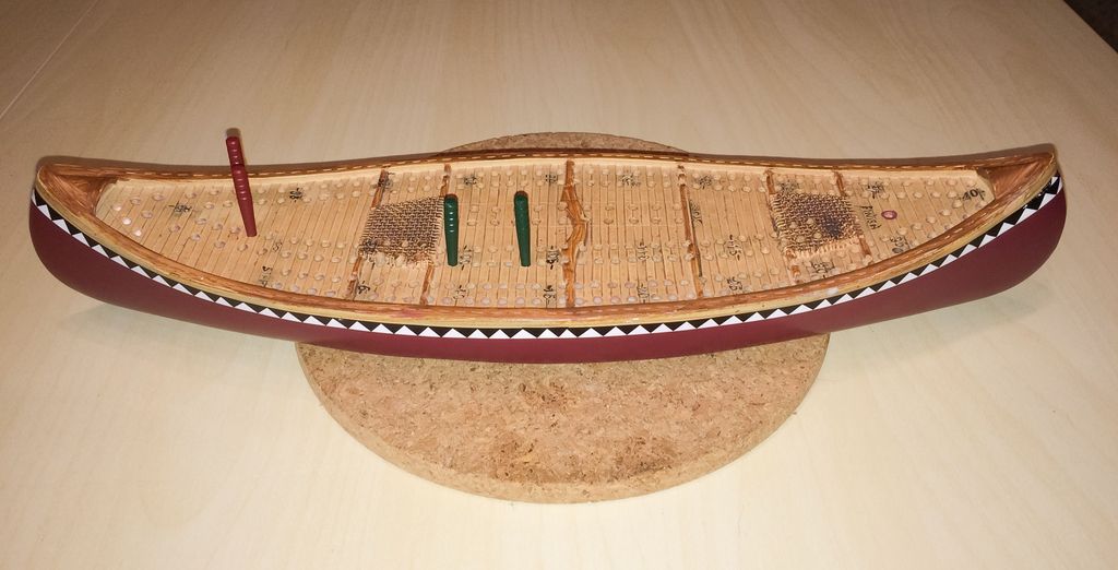 Cribbage - Painted resin canoe cribbage board. - Credit: CatinaBox