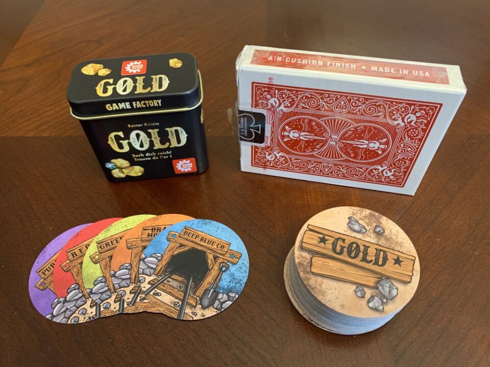 GOLD - Size of GOLD tin and cards, standard deck for scale - Credit: dtmm